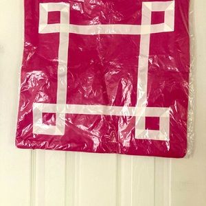 Pillow sham in bright pink with white trim